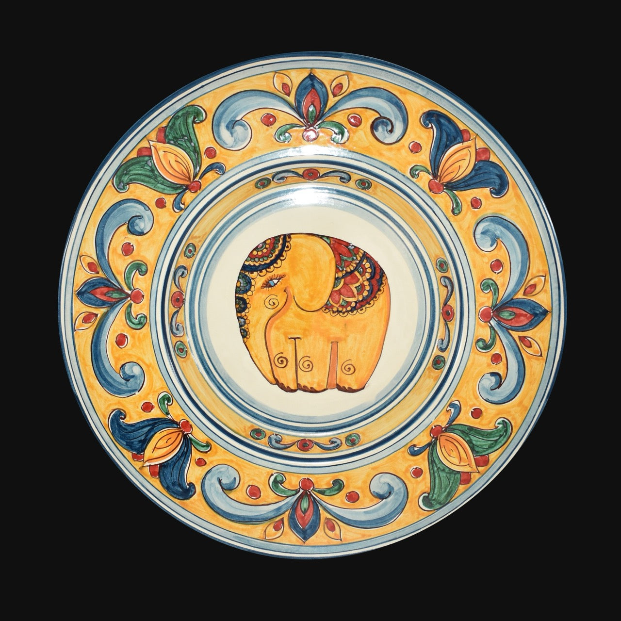 Piatto da parete in ceramica di caltagirone decoro elefante fondo arancio