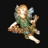 Angelo in ceramica di Caltagirone fatto a mano, con ali blu e vestito verde fiorito, perfetto per decorare la casa.