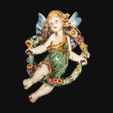 Angelo in ceramica di Caltagirone fatto a mano con ali e ghirlanda floreale colorata